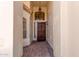 Inviting covered entryway featuring a secure wood door, decorative pendant light, and charming brick pavers at 4779 W Tulsa St, Chandler, AZ 85226