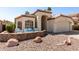 Charming single-story home featuring desert landscaping, a two-car garage, and a cozy seating area at the front of the property at 4779 W Tulsa St, Chandler, AZ 85226