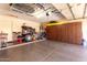 Spacious garage with ample storage cabinets and epoxy flooring for a clean and organized look at 4779 W Tulsa St, Chandler, AZ 85226
