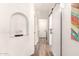 Hallway with a barn door, decorative alcove, and wood-look tile flooring at 4779 W Tulsa St, Chandler, AZ 85226