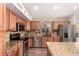 Well-equipped kitchen featuring an island, granite countertops, and stainless steel appliances at 4779 W Tulsa St, Chandler, AZ 85226