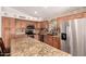 Well-equipped kitchen featuring an island, granite countertops, and stainless steel appliances at 4779 W Tulsa St, Chandler, AZ 85226
