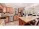 Spacious kitchen with granite countertops, stainless steel appliances, and dining nook at 4779 W Tulsa St, Chandler, AZ 85226