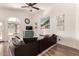 Cozy living room with wood-look floors, a sectional sofa, and a stylish accent cabinet, creating a comfortable retreat at 4779 W Tulsa St, Chandler, AZ 85226