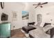 Bright living room with comfortable seating, a ceiling fan, and stylish decor at 4779 W Tulsa St, Chandler, AZ 85226
