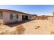 Large backyard featuring desert landscaping, block fence, and covered patio for outdoor enjoyment at 5226 W Thresher Way, Laveen, AZ 85339