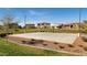 Community basketball court surrounded by lush green space at 5226 W Thresher Way, Laveen, AZ 85339