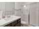 Bathroom showcasing a white vanity top, dark wood cabinets, and a glass-enclosed shower at 5226 W Thresher Way, Laveen, AZ 85339