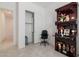 Bedroom featuring tile floors, a closet, and a dark wood shrine at 5226 W Thresher Way, Laveen, AZ 85339