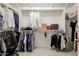 Organized walk-in closet with shelving, hanging rods, and ample storage space for clothing and accessories at 5226 W Thresher Way, Laveen, AZ 85339