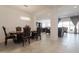 Elegant dining room featuring classic furniture, tile flooring and an open layout to the living spaces at 5226 W Thresher Way, Laveen, AZ 85339