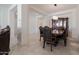 Elegant dining area featuring classic furniture, tiled floors and a seamless transition to other rooms at 5226 W Thresher Way, Laveen, AZ 85339