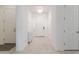 Bright entryway featuring white walls, tile flooring, and decorative lighting, creating a welcoming atmosphere at 5226 W Thresher Way, Laveen, AZ 85339