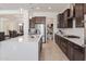 Well-lit open kitchen featuring a center island, stainless steel appliances, and walk-in pantry at 5226 W Thresher Way, Laveen, AZ 85339
