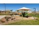 Community playground with shaded play structure and landscaping for families to enjoy outdoor time at 5226 W Thresher Way, Laveen, AZ 85339