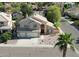 A suburban home featuring desert landscaping, a two-car garage, and a beautiful tile roof at 53 W Pecan Pl, Tempe, AZ 85284