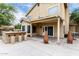 Spacious covered patio with built-in barbecue, perfect for outdoor entertaining with pool view at 53 W Pecan Pl, Tempe, AZ 85284