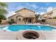 Enjoy the backyard oasis with a refreshing pool, covered patio, and outdoor seating areas at 53 W Pecan Pl, Tempe, AZ 85284