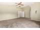 Spacious bedroom featuring neutral walls, carpet, and access to another room through double doors at 53 W Pecan Pl, Tempe, AZ 85284