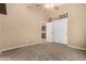 Bedroom featuring neutral walls, a ceiling fan, and a double-door closet for ample storage at 53 W Pecan Pl, Tempe, AZ 85284