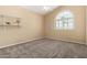 Bright bedroom with a vaulted ceiling, a white shelf, and a decorative window with arched top at 53 W Pecan Pl, Tempe, AZ 85284