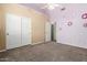 Bedroom with a ceiling fan, large closet, and colorful wall decorations for  at 53 W Pecan Pl, Tempe, AZ 85284