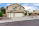 A two-story home with a two-car garage, desert landscaping, a basketball hoop, and a tile roof at 53 W Pecan Pl, Tempe, AZ 85284