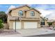A two-story home with a two-car garage, desert landscaping, a basketball hoop, and a tile roof at 53 W Pecan Pl, Tempe, AZ 85284
