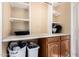 Well-organized laundry room featuring ample counter space, and storage, combining functionality and efficiency at 53 W Pecan Pl, Tempe, AZ 85284