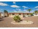 Spacious backyard featuring desert landscaping and patio area, perfect for outdoor relaxation at 5323 E Dodge St, Mesa, AZ 85205