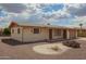 Charming single-story home featuring desert landscaping and a neutral color palette at 5323 E Dodge St, Mesa, AZ 85205