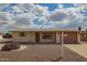 Charming home exterior with desert landscaping, mailbox and two-car garage at 5323 E Dodge St, Mesa, AZ 85205