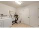 Spacious laundry room with sink, toilet, washer, and dryer at 5323 E Dodge St, Mesa, AZ 85205