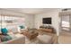 Bright living room featuring modern furniture, neutral tones, and natural light at 5323 E Dodge St, Mesa, AZ 85205