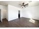 Bright bedroom showcasing hardwood floors, a ceiling fan, and neutral walls, ideal for personalization at 5719 E Santa Clara Dr, San Tan Valley, AZ 85140