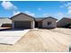 Charming single-story home showcasing a gray garage door, stucco exterior, and a well-maintained front yard at 5719 E Santa Clara Dr, San Tan Valley, AZ 85140