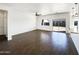 Open concept living room with modern lighting and hardwood floors, connecting seamlessly to the outdoor living space at 5719 E Santa Clara Dr, San Tan Valley, AZ 85140