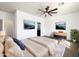 Inviting main bedroom with soft lighting, a ceiling fan, and hardwood floors, creating a relaxing ambiance at 5719 E Santa Clara Dr, San Tan Valley, AZ 85140