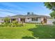Backyard with lush green grass, BBQ, and beautiful landscaping, great for entertaining at 6231 E Calle Camelia --, Scottsdale, AZ 85251