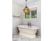 Elegant bathroom featuring a freestanding tub with vintage-style fixtures and a bright window view at 6231 E Calle Camelia --, Scottsdale, AZ 85251