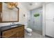 Bathroom featuring a vanity with dark countertops and shower with clear glass doors at 6231 E Calle Camelia --, Scottsdale, AZ 85251