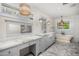 Bright bathroom featuring a large vanity with double sinks, white subway tile, and a soaking tub at 6231 E Calle Camelia --, Scottsdale, AZ 85251