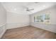 Bright bedroom featuring wood floors, a ceiling fan and molding detail throughout at 6231 E Calle Camelia --, Scottsdale, AZ 85251