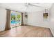 Sunlit bedroom with hardwood floors and French doors leading to the backyard pool area at 6231 E Calle Camelia --, Scottsdale, AZ 85251