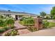 Charming single-story home with a brick walkway, lush landscaping, and colorful flower beds at 6231 E Calle Camelia --, Scottsdale, AZ 85251