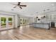 Open-concept living space with hardwood floors, recessed lighting, and a kitchen view at 6231 E Calle Camelia --, Scottsdale, AZ 85251