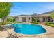 Inviting kidney-shaped pool surrounded by a brick patio and green landscaping at 6231 E Calle Camelia --, Scottsdale, AZ 85251