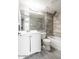 Modern bathroom features a bathtub, vanity, and stylish gray tiling at 6240 N 16Th St # 40, Phoenix, AZ 85016