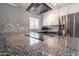 Modern kitchen with granite countertops and stainless steel appliances at 6240 N 16Th St # 40, Phoenix, AZ 85016