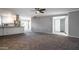 Open concept living room with modern kitchen and gray carpeting at 6240 N 16Th St # 40, Phoenix, AZ 85016